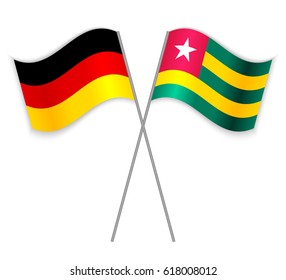 German and Togolese crossed flags. Germany combined with Togo isolated on white. Language learning, international business or travel concept.