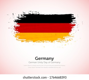 German unity day of Germany country. Abstract flag in shape of paint brush stroke with shiny colored background