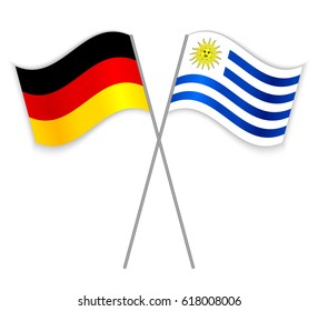 German and Uruguayan crossed flags. Germany combined with Uruguay isolated on white. Language learning, international business or travel concept.