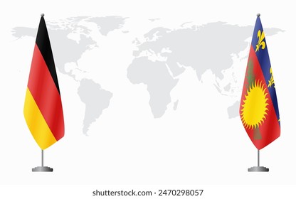 Germany and Guadeloupe flags for official meeting against background of world map.