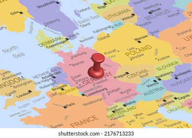 Germany with red fastener pushpin on europe map, close up Germany, pinned destination, travel idea, colorful map with location icon, vacation and road trip concept, top view