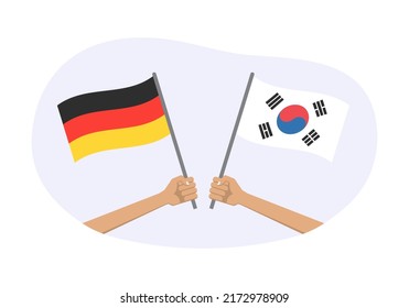 Banderas de Alemania y Corea del Sur. Símbolos coreanos y alemanes. Mano sosteniendo la bandera ondeando. Ilustración vectorial.