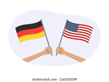 Germany and USA flags. American and German national symbols. Hand holding waving flags. Vector illustration.