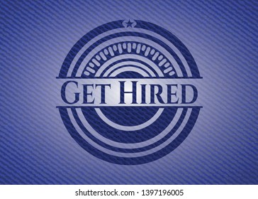 Get Hired emblem with jean texture. Vector Illustration. Detailed.