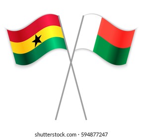 Ghanaian and Malagasy crossed flags. Ghana combined with Madagascar isolated on white. Language learning, international business or travel concept.
