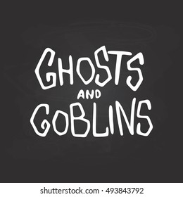 Ghosts and goblins - Halloween party hand drawn lettering phrase card, isolated on the black chalkboard. Fun brush ink typography greeting card, illustration for t-shirt print, flyer, poster design.