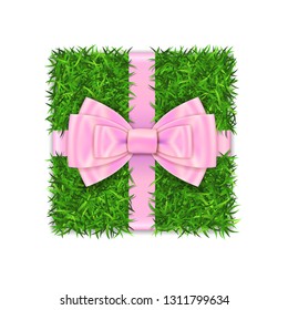 Gift box 3D. Green grass box top view, pink ribbon bow isolated white background. Nature friendly design. Eco packaging. Concept recycle. Organic lawn, meadow. Holiday decoration Vector illustration