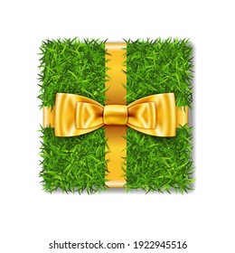 Gift box 3D. Green grass box top view, gold ribbon bow, isolated white background. Nature friendly design. Eco packaging. Concept recycle. Organic lawn, meadow. Holiday decoration Vector illustration