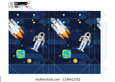 gift box with an astronaut and a space shuttle in orbit