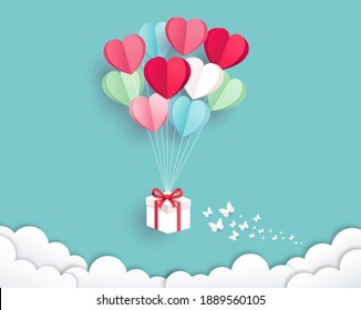 Caja de regalo con globo sobre el estilo de corte de papel cielo. Fondo del día de San Valentín.