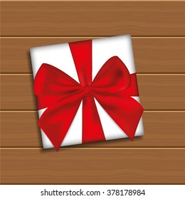  Gift Box with Bow on Wooden Background