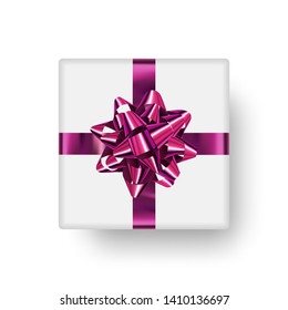 Gift box with bright, shiny bow and realistic falling shadow. Ready clipart object for decoration. Realistic vector element.
