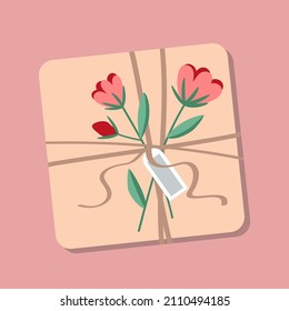 Gift box in craft paper on an isolated pink background. The gift is decorated with a flower twig and tied with a twine. The box is drawn in flat style.
