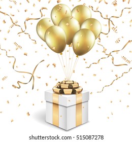 Caja de regalo con globos dorados