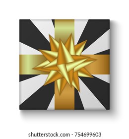 Gift box with golden ribbon bow for New Year, Christmas holiday or Birthday greeting card design.