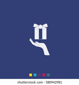 Gift box in hand.