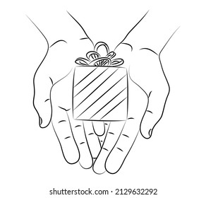Gift box in hand. Holding or offering present. Tradition to give gifts for holidays, celebrations, Christmas, birthday or wedding. Attention to close people, friends, relatives, business colleagues