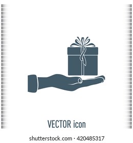 Gift box and hand icon