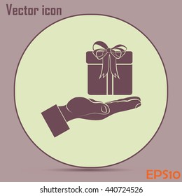 Gift box and hand icon