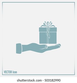 Gift box and hand icon