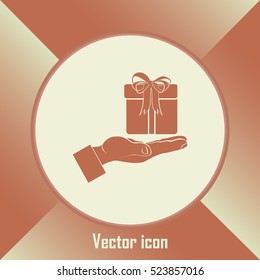 Gift box and hand icon