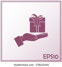 Gift box and hand icon