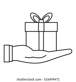 Gift box in hand icon. Outline illustration of gift box in hand vector icon for web design