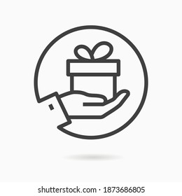 Gift box in hand line icon. Vector illustration on white background.