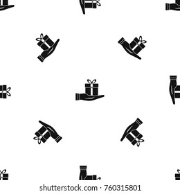 Gift box in hand pattern repeat seamless in black color for any design. Vector geometric illustration
