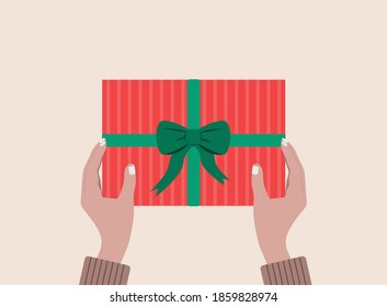 Gift box in hands. Prepares  gift for birthday, Thanksgiving, Christmas  Happy New Year, or Saint Valentine Day. Flat vector illustration. Eps 10.