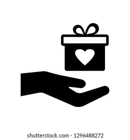 Gift box with heart in hand. Black icon. Vector illustration