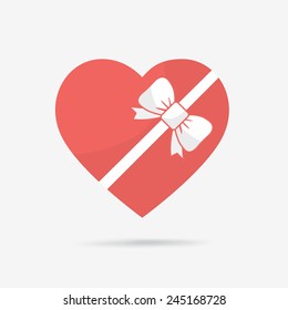 Gift box of heart tied with ribbon.