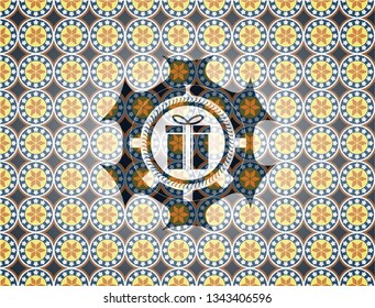 gift box icon inside arabesque style badge. arabic decoration.