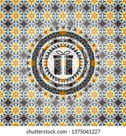 gift box icon inside arabesque style badge. arabic decoration.