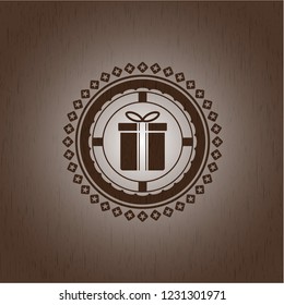 gift box icon inside badge with wooden background