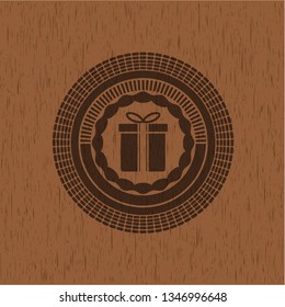 gift box icon inside badge with wooden background