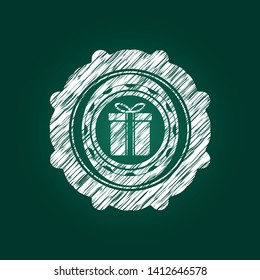 gift box icon inside chalk emblem written on a blackboard