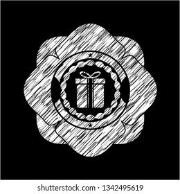 gift box icon inside chalkboard emblem written on a blackboard
