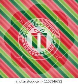 gift box icon inside christmas badge.
