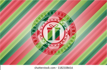  gift box icon inside christmas colors badge.