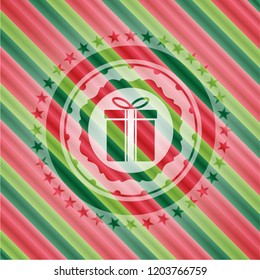gift box icon inside christmas colors style badge.