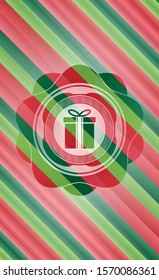 gift box icon inside christmas badge.