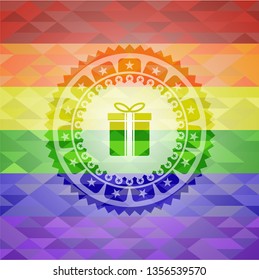 gift box icon inside emblem on mosaic background with the colors of the LGBT flag