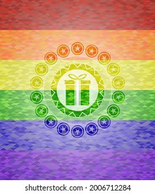 gift box icon inside emblem on mosaic background with the colors of the LGBT flag. 