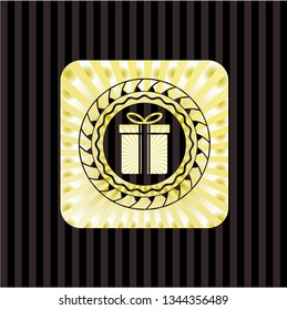 gift box icon inside gold shiny emblem