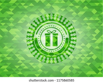 gift box icon inside green emblem with mosaic ecological style background