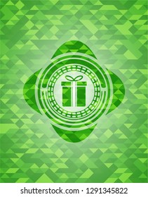 gift box icon inside green emblem with mosaic ecological style background