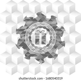 gift box icon inside grey icon or emblem with geometric cube white background