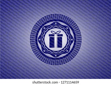 gift box icon inside jean or denim emblem or badge background