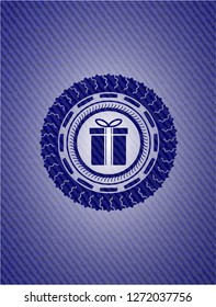 gift box icon inside jean or denim emblem or badge background